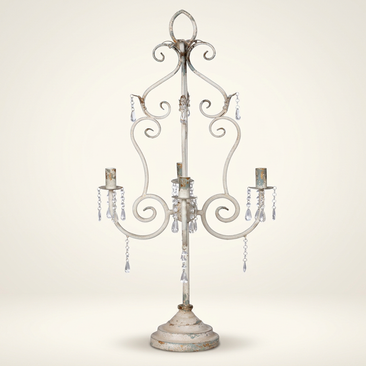 French Country Crystal Table Chandelier with distressed white iron frame and crystal drops against a warm white studio background.