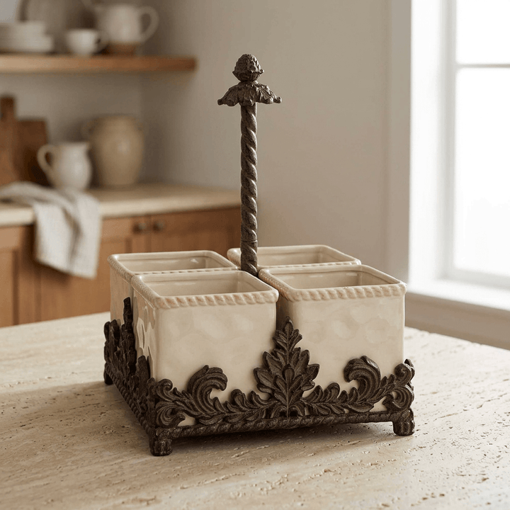 Bellavita stoneware flatware caddy with dark brown scrolling metal base on a light stone kitchen counter