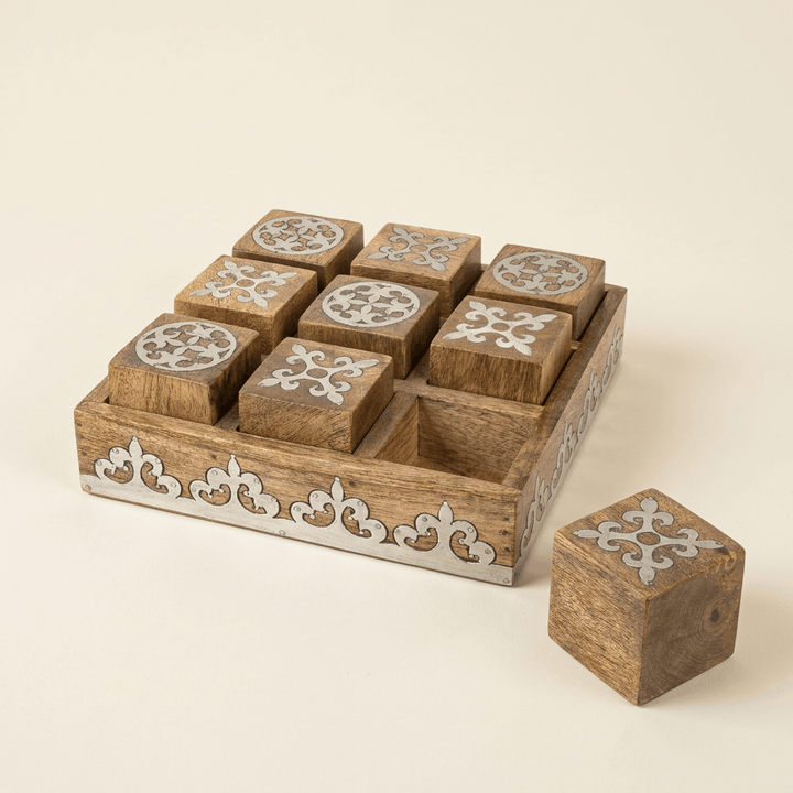 Belvedere mango wood tic tac toe game with silver-tone scrollwork inlay on an ivory studio background.