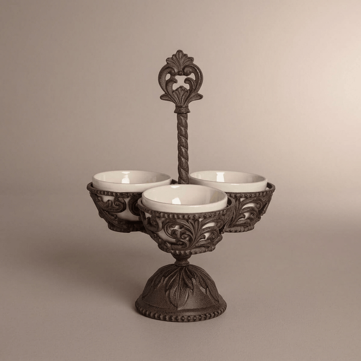 Full view of Bellavita Stoneware Condiment Server with ornamental handle and pedestal against taupe.