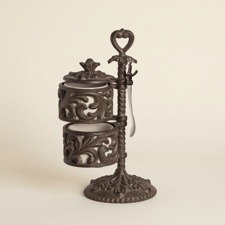 Bellavita Spice Cellar with two cream ceramic jars and ornate dark metal stand on an ivory background.