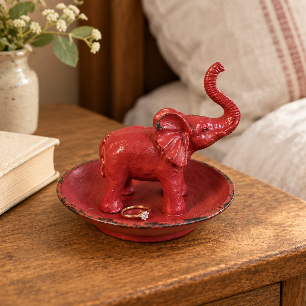 Antique Red Pewter Elephant Ring Dish styled on an oak bedside table