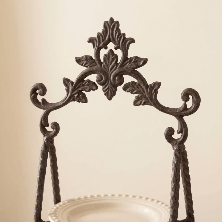 Close-up of the Bellavita serving stand's acanthus crest and twisted metal uprights