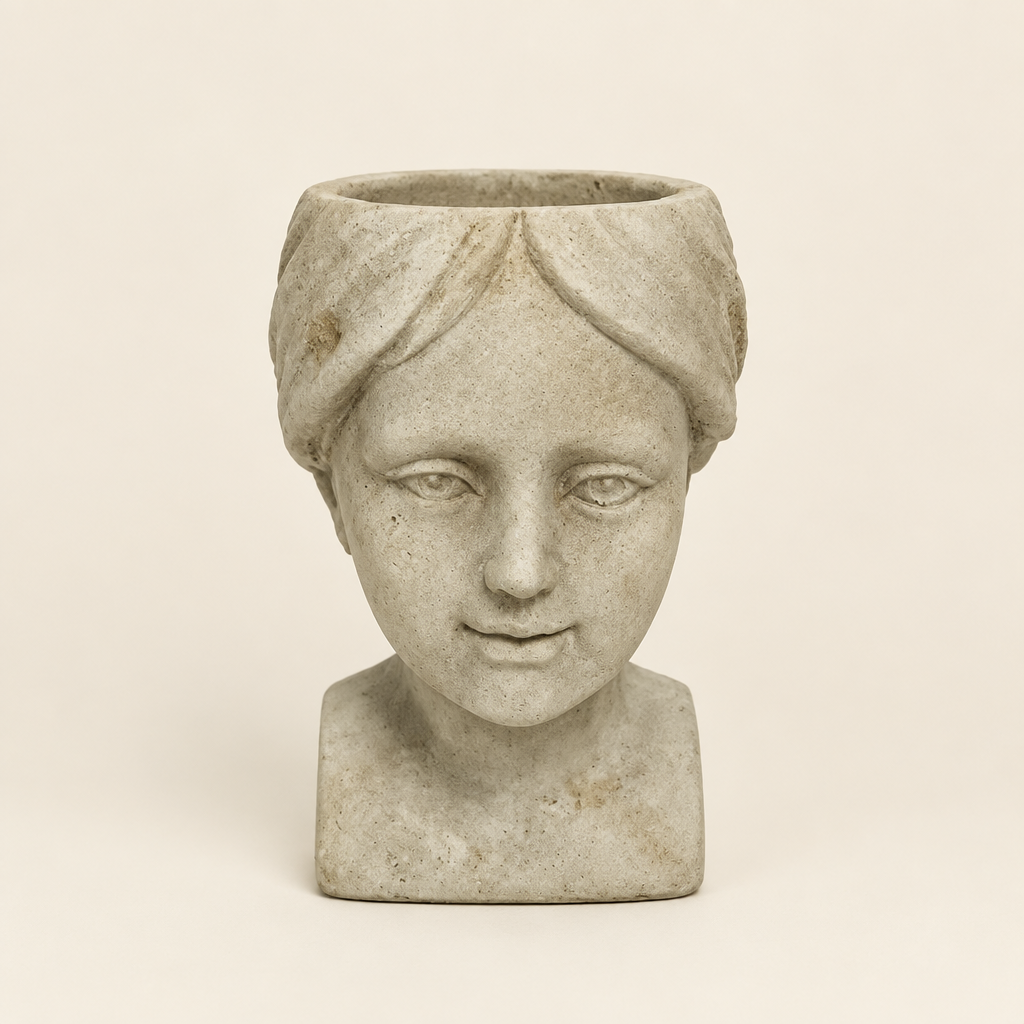 Cement Girl Head Planter on a warm ivory studio background