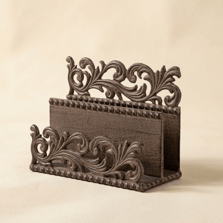Bellavita Letter Holder in dark bronze-brown cast metal with openwork acanthus scrollwork and beaded trim, on a cream studio backdrop