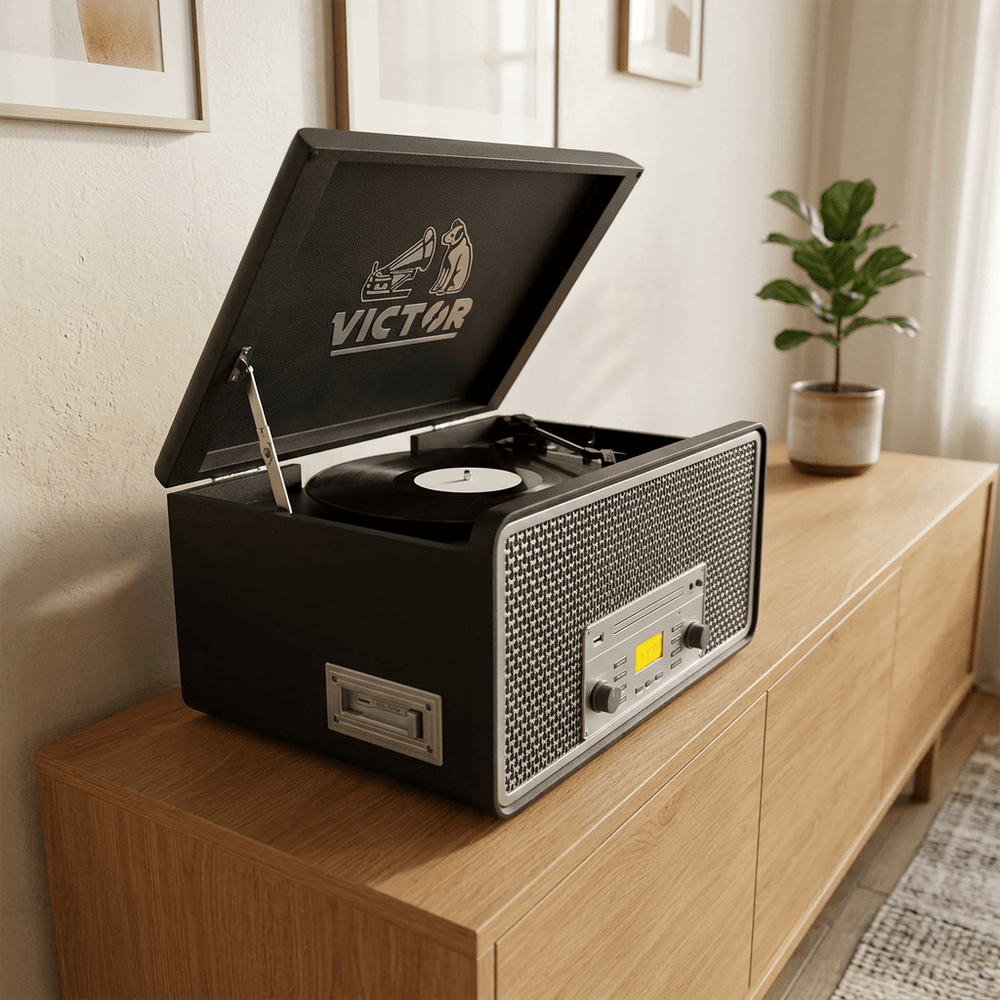 Graphite Monument music center with silver controls and open lid on an oak sideboard in a contemporary listening nook.