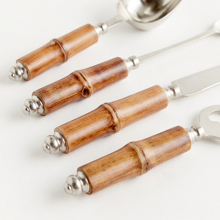 Close-up of natural bamboo grain, raised nodes, and stainless steel fittings on the cocktail tool handles.