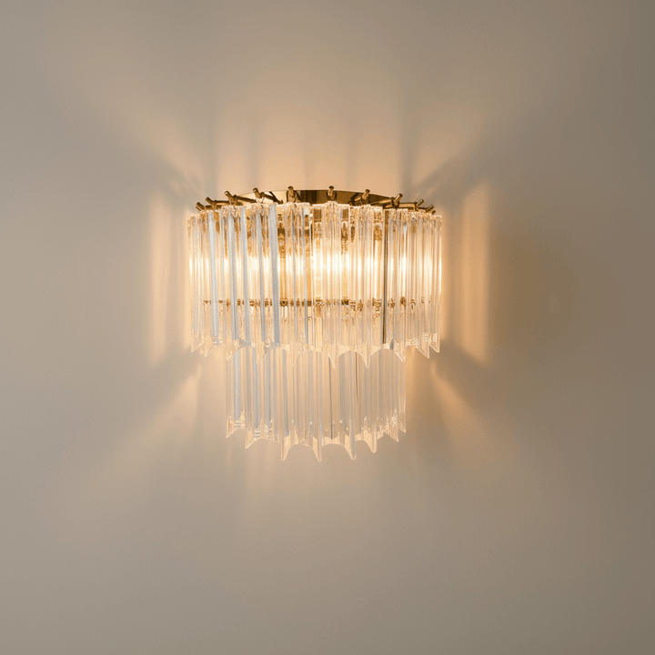 Italian Clear Glass and Polished Brass Wall Sconce illuminating a room with vintage elegance and Italian craftsmanship.