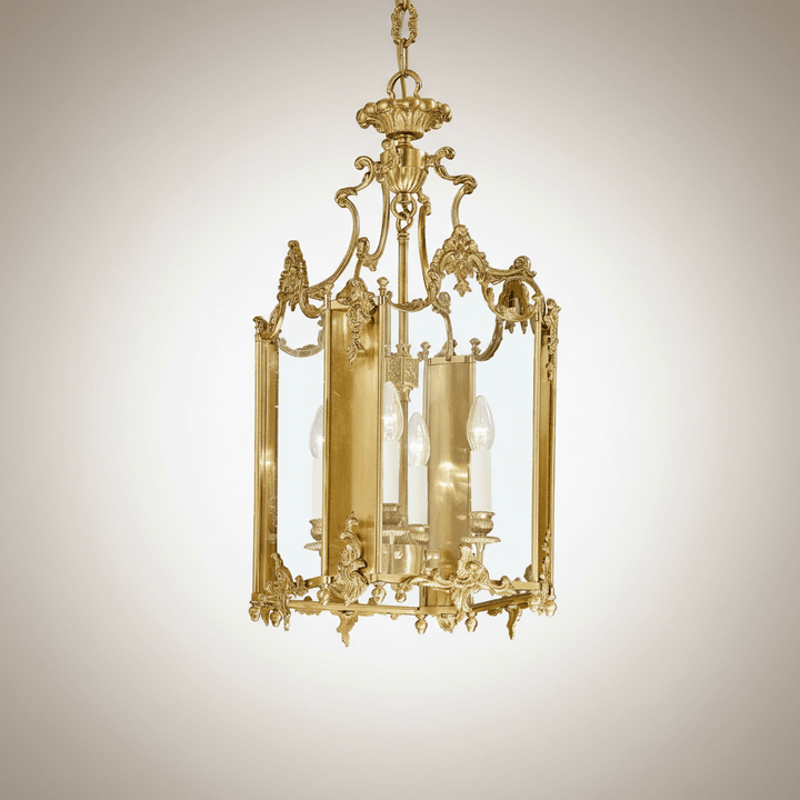 Decorative gold chandelier on a beige background