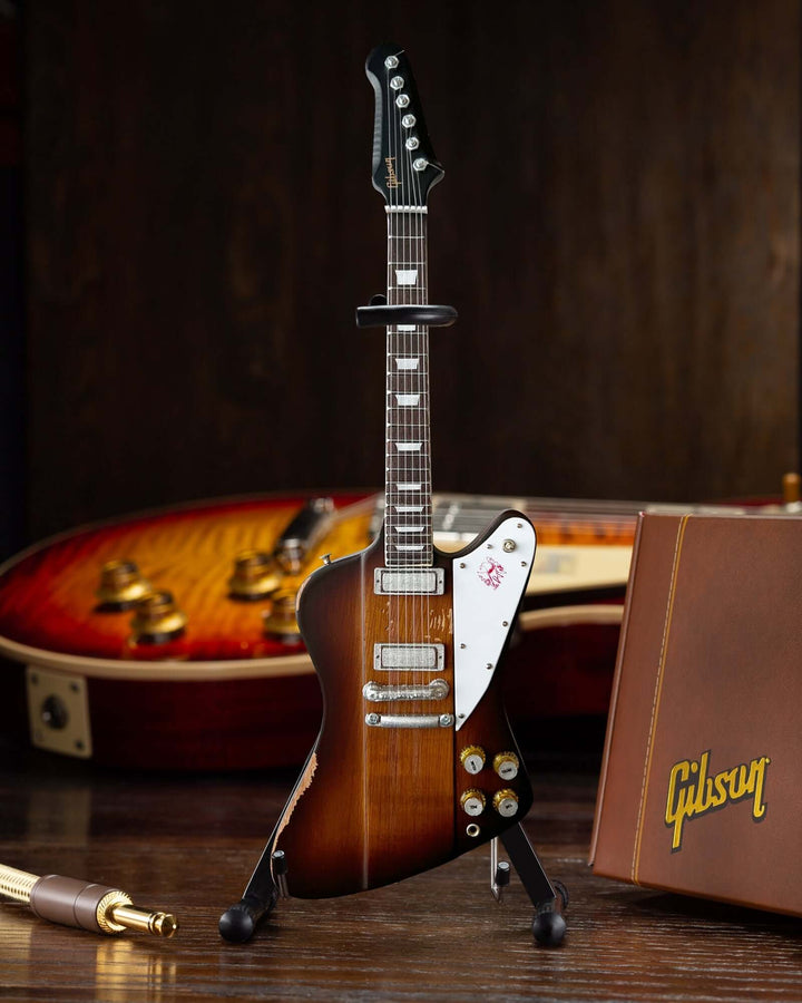 Johnny Winter 1963 Firebird Mini Guitar Replica on stand with Gibson logo box.