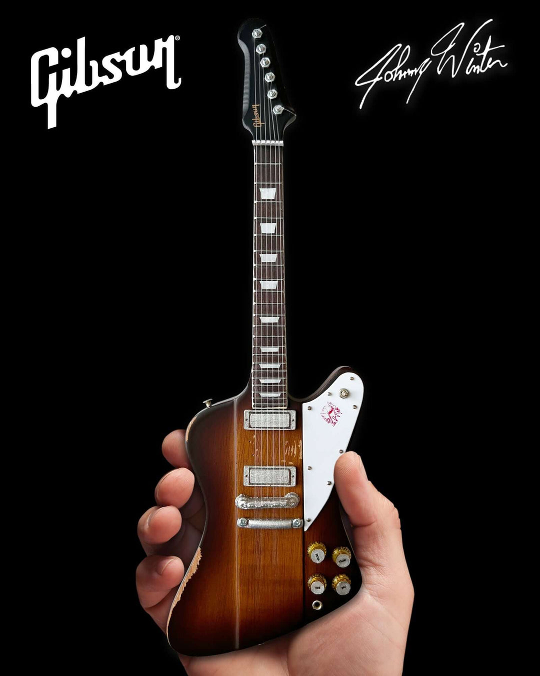 Johnny Winter 1963 Firebird Mini Guitar Replica in hand, showcasing detailed craftsmanship. Officially licensed, honoring the legendary guitarist.