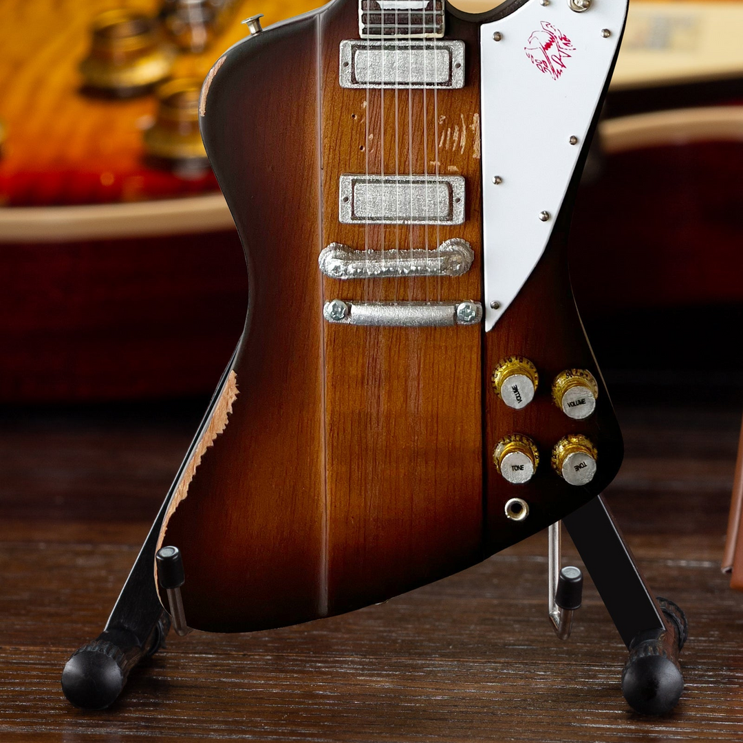 Johnny Winter 1963 Firebird Mini Guitar Replica on display stand