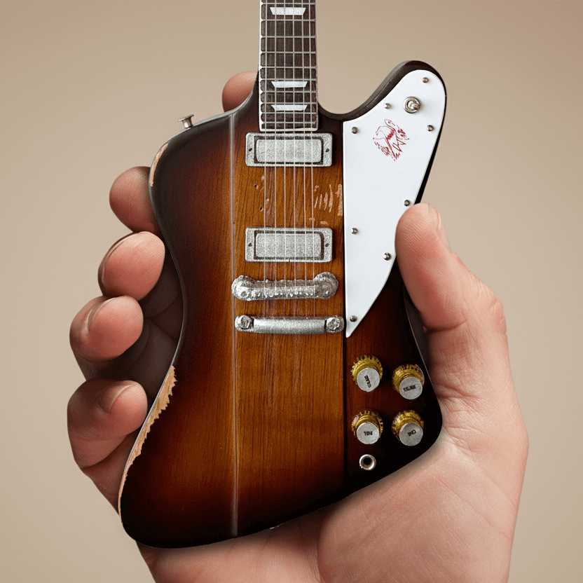 Johnny Winter 1963 Firebird Mini Guitar Replica held in hand, showcasing intricate details in 1:4 scale, a tribute to blues-rock legacy.