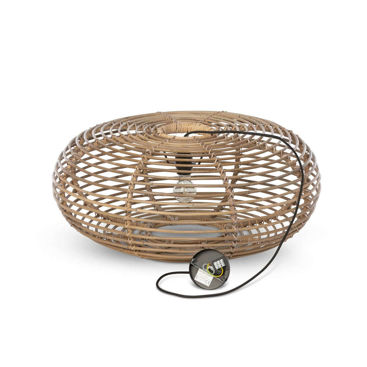Wicker basket with a light bulb inside on a white background