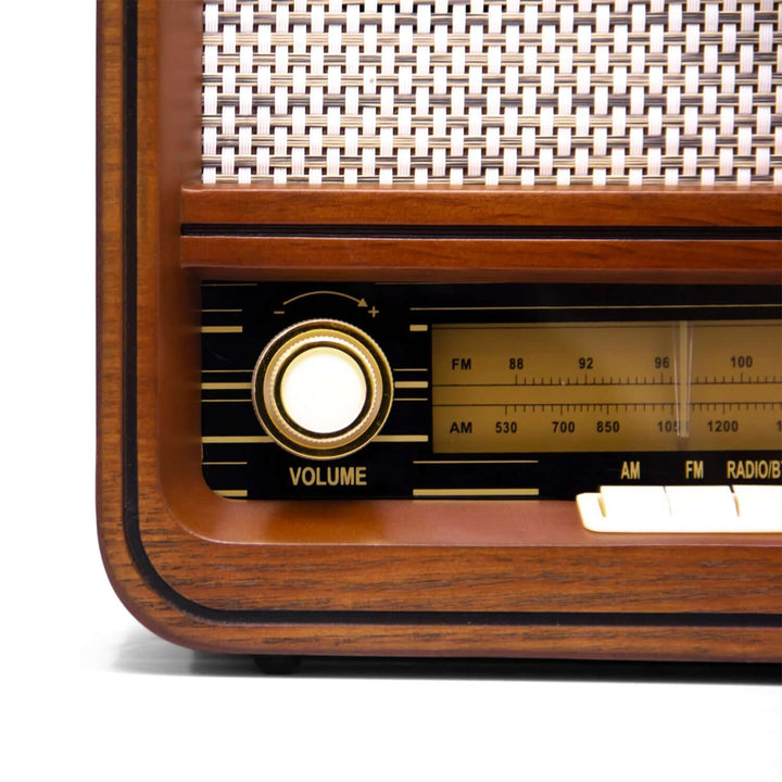Close-up of a vintage wooden radio with a white background