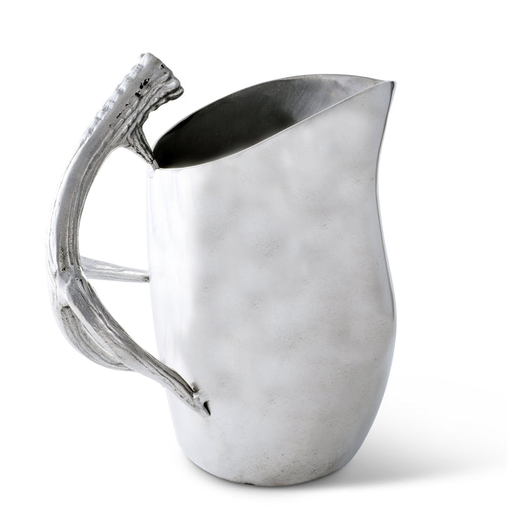 Lodge Style Antler Pitcher with sculptural antler handle, handcrafted for a blend of wilderness and refinement.