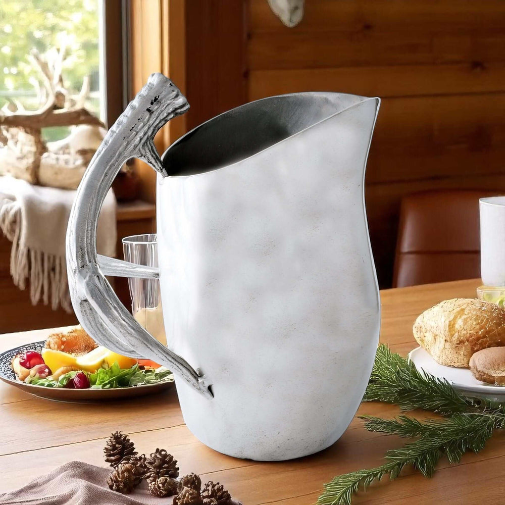 Lodge Style Antler Pitcher on rustic wooden table with fruit and pastries