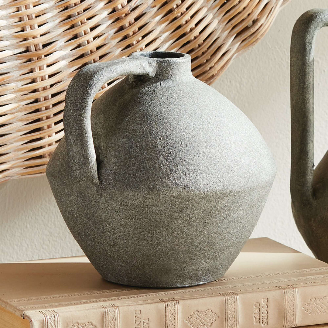 Handcrafted terracotta amphora-style decorative vase with textured finish, embodying Mediterranean charm.