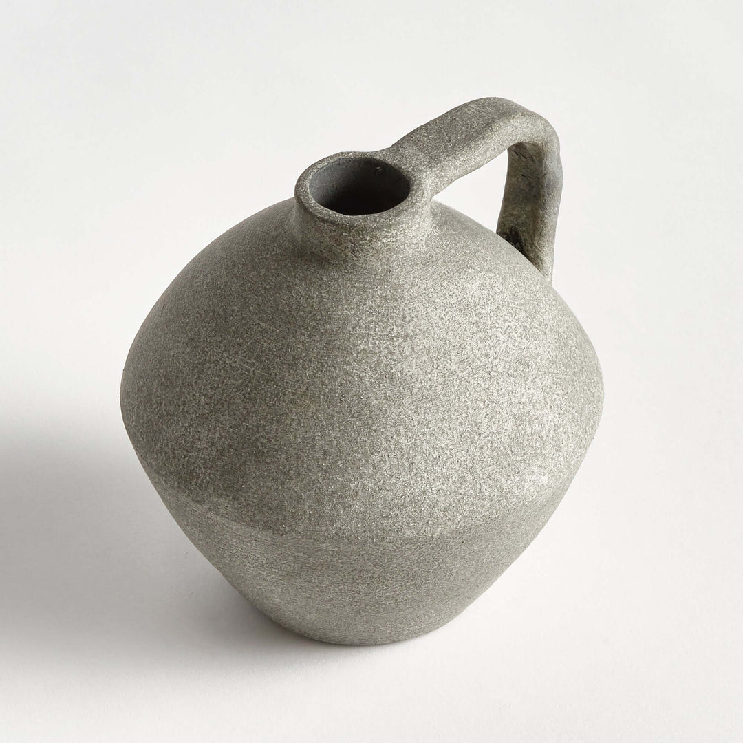 Handcrafted terracotta amphora style decorative vase with a textured finish, evoking Mediterranean coastal charm.