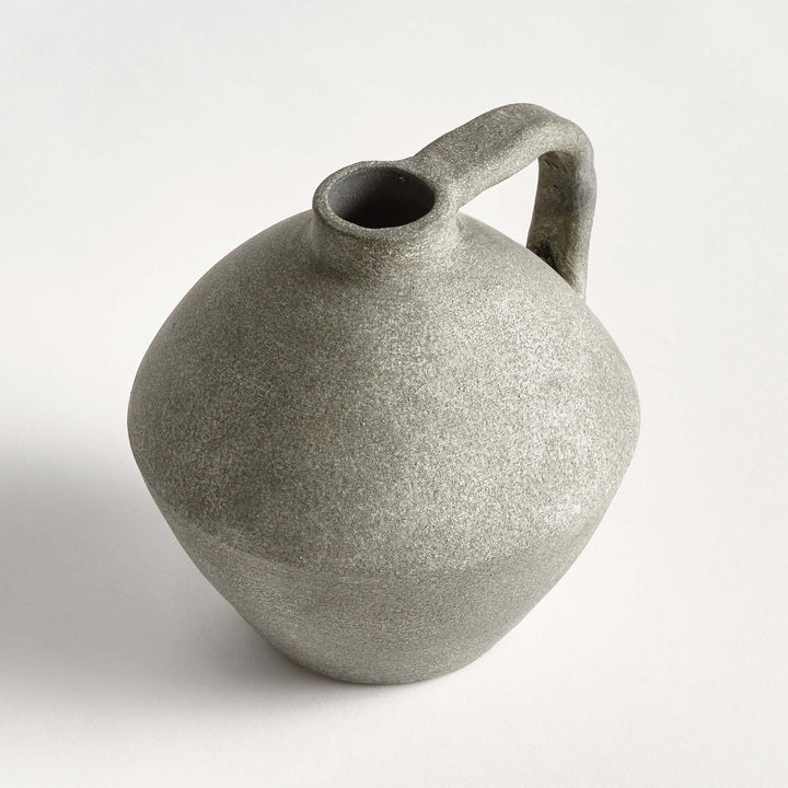 Handcrafted terracotta amphora style decorative vase with a textured finish, evoking Mediterranean coastal charm.