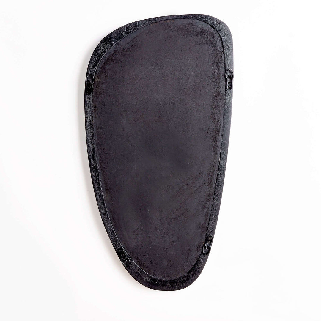 Mid-century modern asymmetrical black wood mirror with sculptural design, ideal for contemporary home decor.