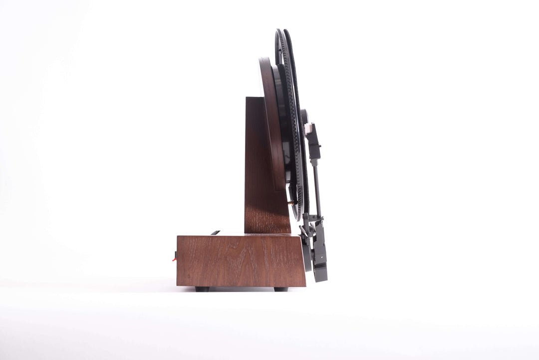 Wooden turn table from the side with a white background