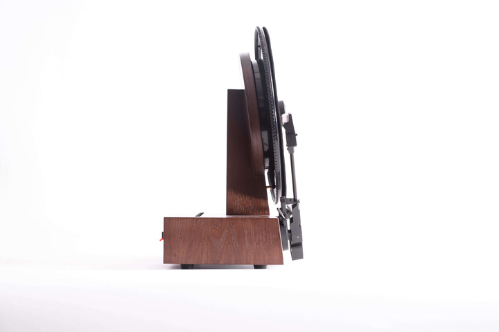 Wooden turn table from the side with a white background