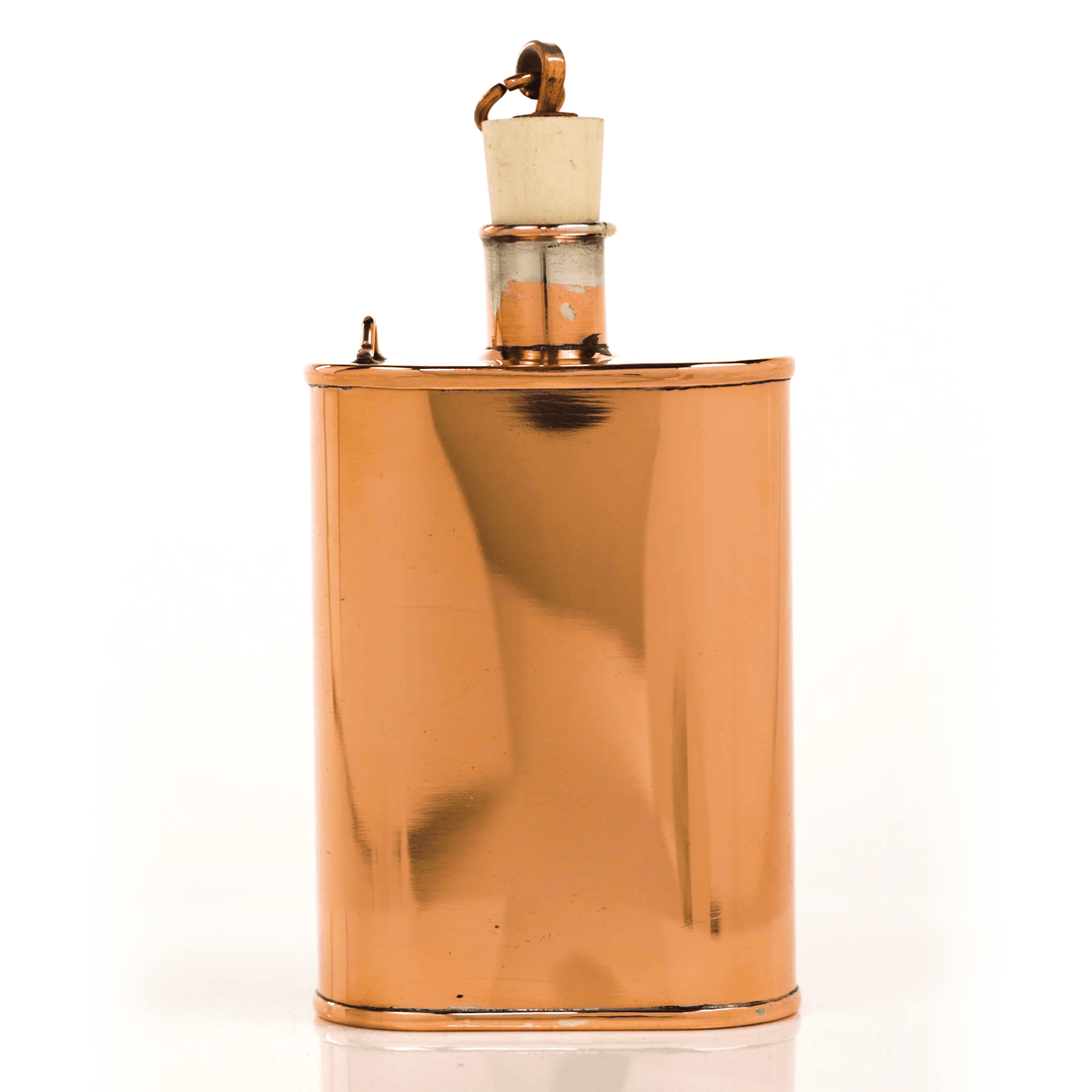 Model One Original Copper Flask - handcrafted, vintage American copper flask with cork stopper, emblematic of traditional craftsmanship.