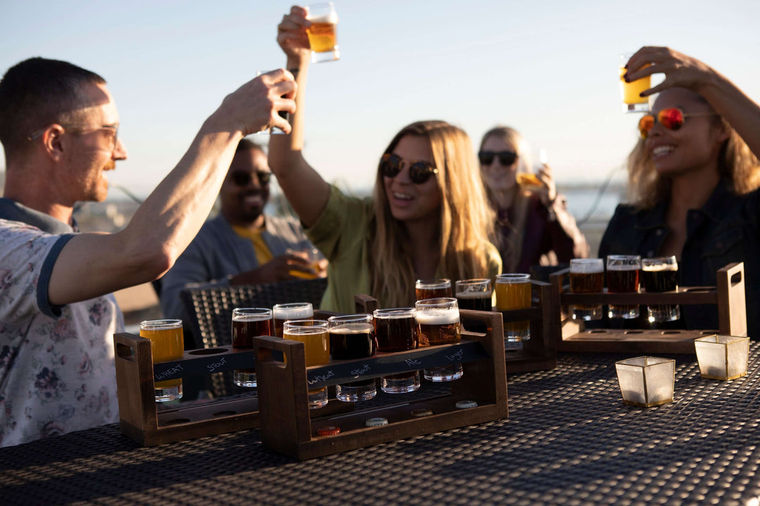 Group enjoying drinks with a Rustic Craft Beer Flight Tasting Set outdoors