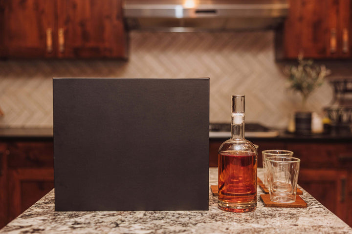Old World Whiskey Decanter and Glass Set in Faux Leather Case on a kitchen counter.