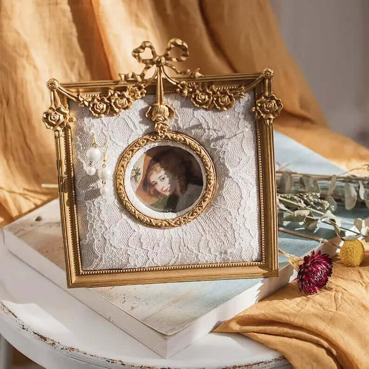 Gold-tone framed earring holder in a styled setting