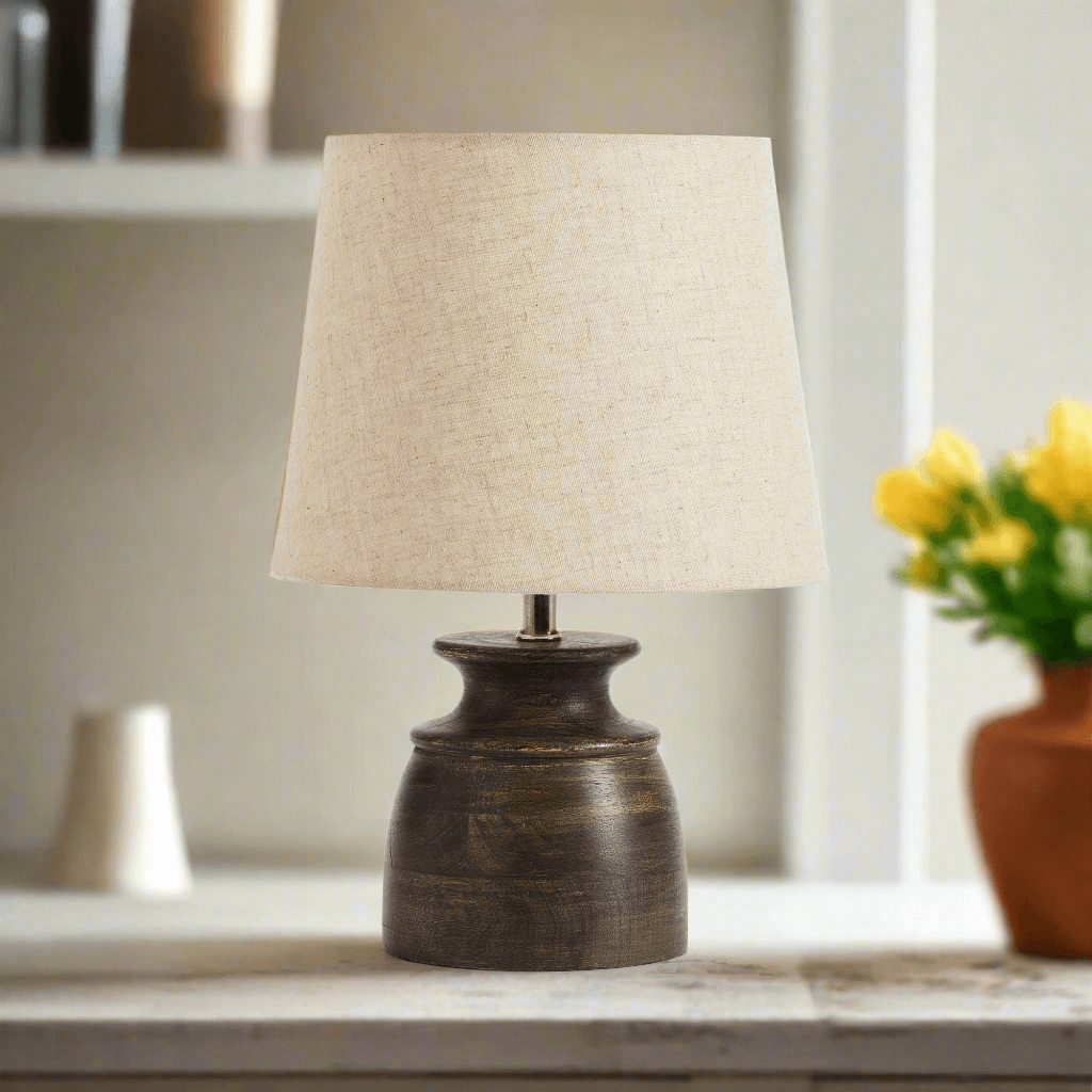 Petite mango wood desk lamp with natural linen shade, perfect for adding rustic charm to small spaces.