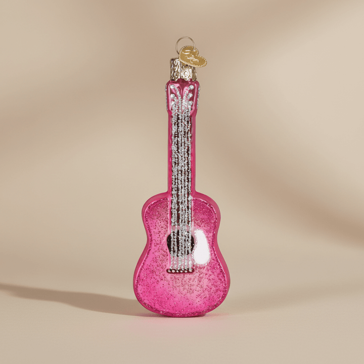 Pink Glitter Guitar Christmas Ornament shining with vibrant pink sparkles, handcrafted for a musical celebration of joy and festive decor.
