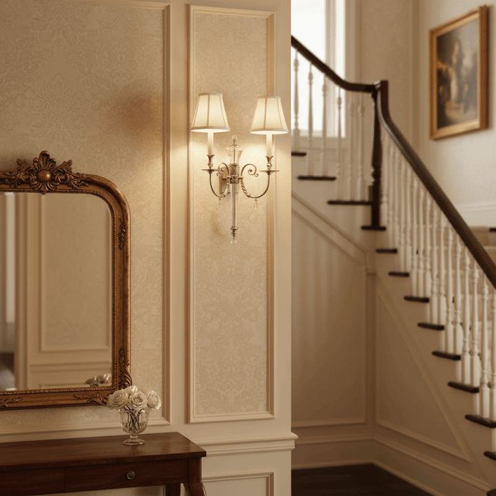 Polished Nickel Double Arm Sconce with Crystal Accents illuminating a classic interior, evoking vintage glamour and sophistication.