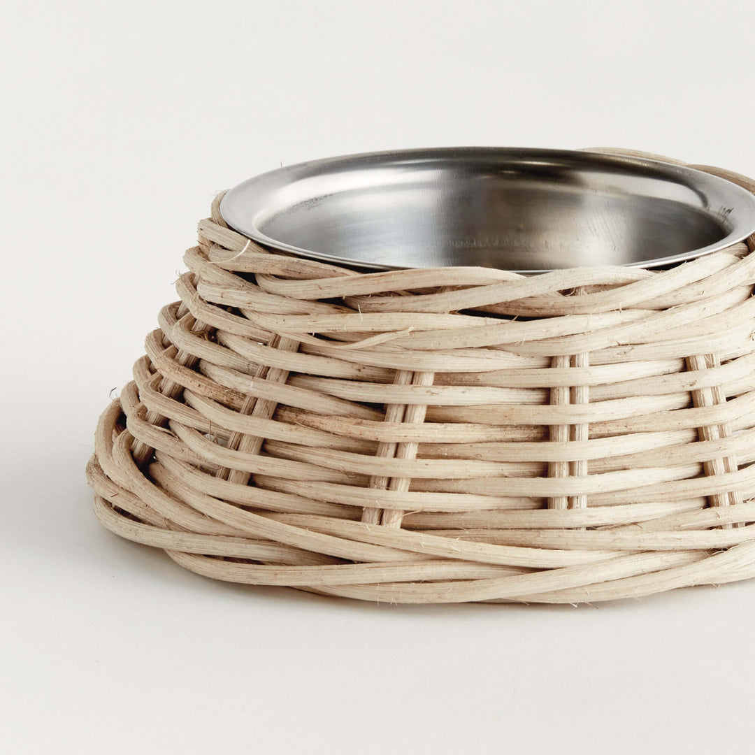 Handwoven Rattan Pet Bowl with Stainless Steel Insert, featuring rustic charm and a sturdy natural texture for stylish pet dining.