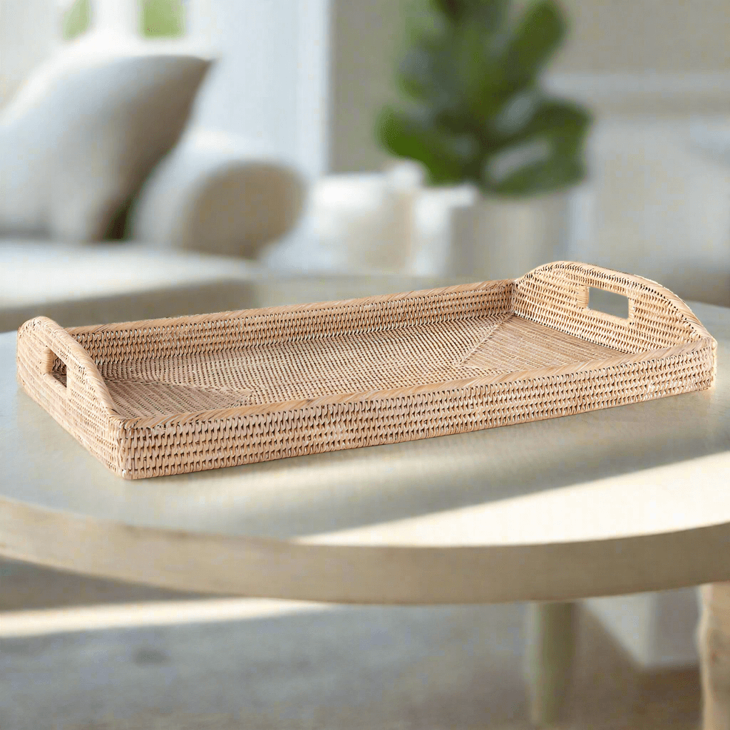 Rattan serving tray with handles in natural finish, perfect for vintage-inspired decor and everyday use.