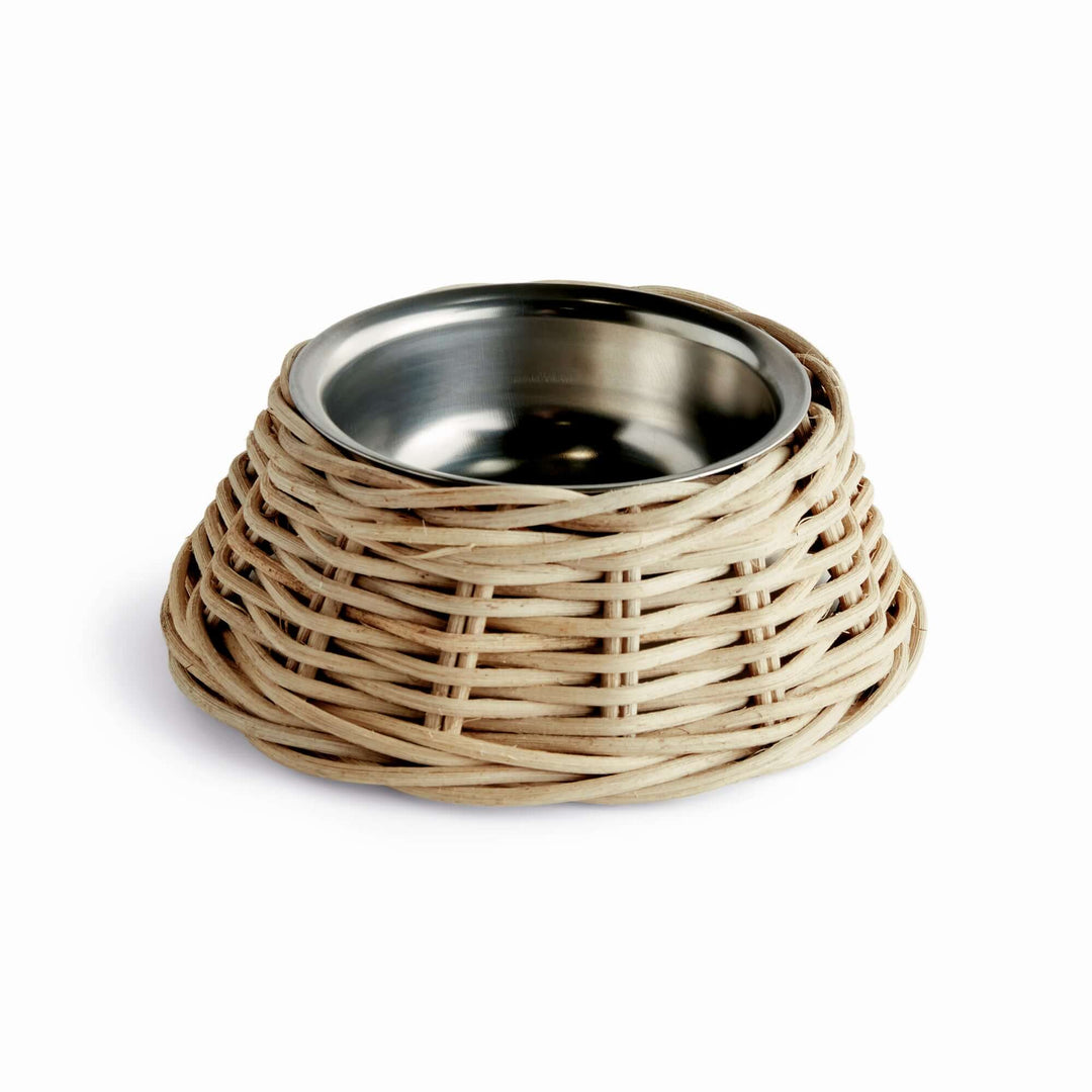 Rattan Pet Bowl with Stainless Steel Insert featuring a handwoven rattan base and stainless steel interior for pets. Rustic and stylish.