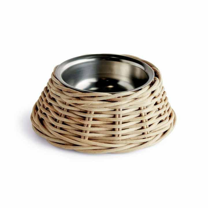 Rattan Pet Bowl with Stainless Steel Insert featuring a handwoven rattan base and stainless steel interior for pets. Rustic and stylish.