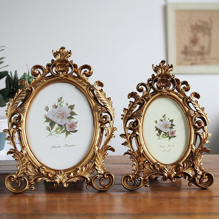 Regal Crown Oval Photo Frames in two sizes on a wood tabletop