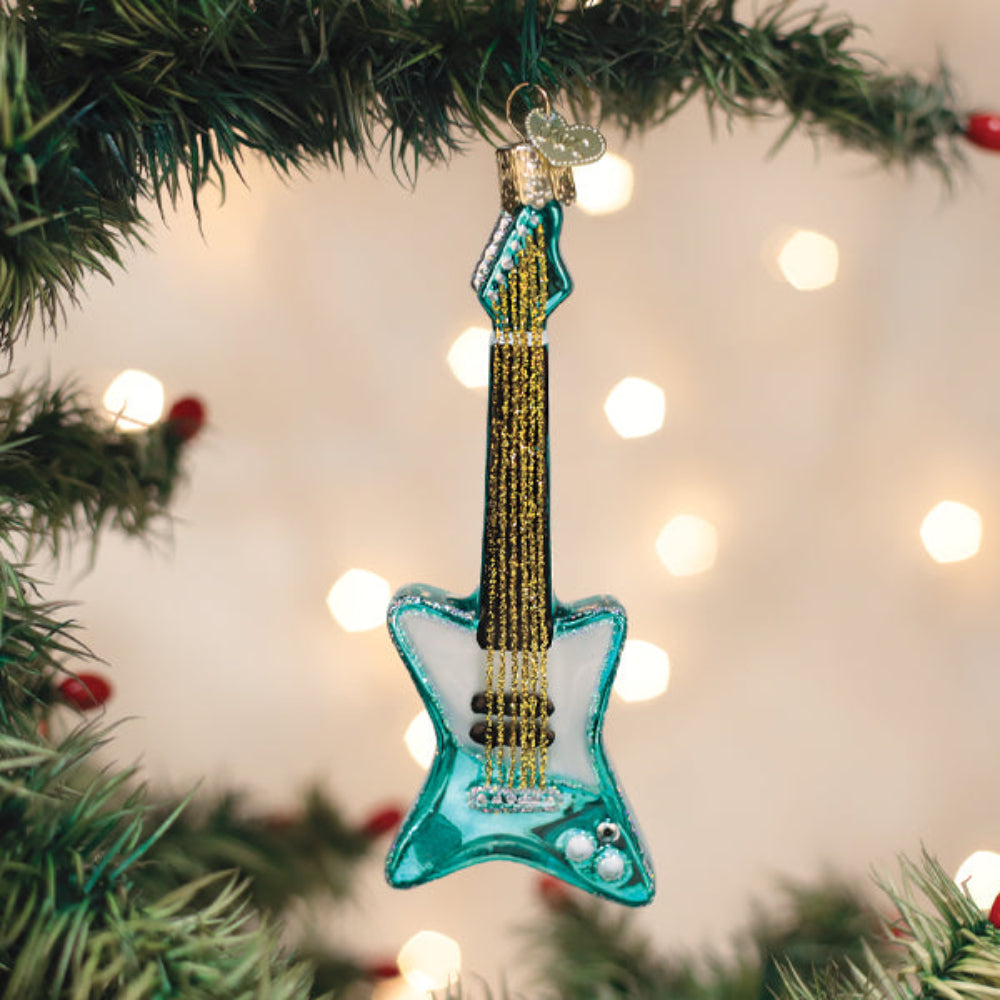 Retro Electric Guitar Christmas Ornament hanging on a festive tree with lights in the background.