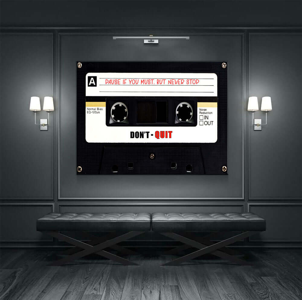 Retro Cassette Tape Motivational Wall Art with "Don't Quit" message hanging on a modern wall with ambient lighting.