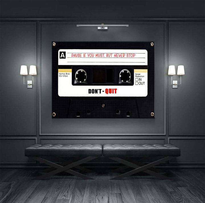 Retro Cassette Tape Motivational Wall Art with "Don't Quit" message hanging on a modern wall with ambient lighting.