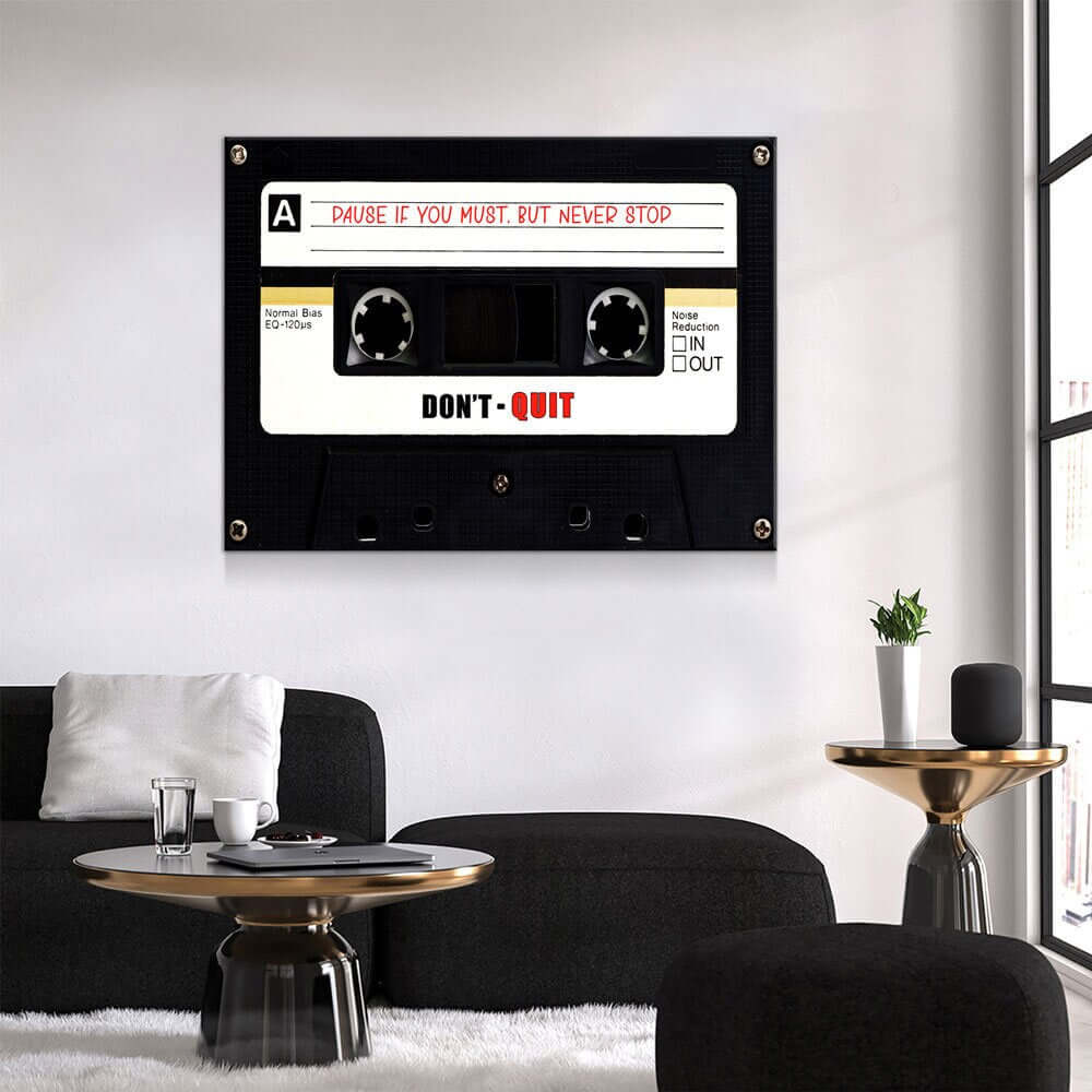 Retro Cassette Tape Motivational Wall Art hanging in a modern living room interior, featuring an inspiring message with a cassette design.