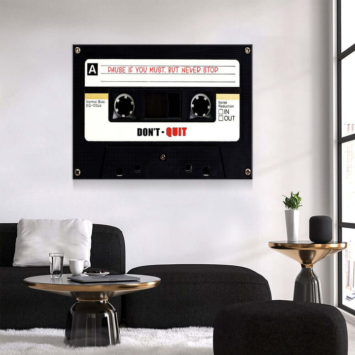 Retro Cassette Tape Motivational Wall Art hanging in a modern living room interior, featuring an inspiring message with a cassette design.