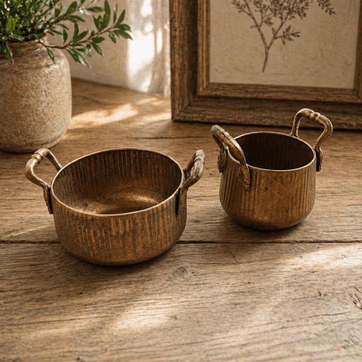 Empty Ribbed Antique Metal Planters with Handles, Set of 2 on a wood table
