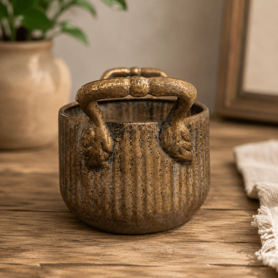 Close view of the smaller Ribbed Antique Metal Planter with Handles