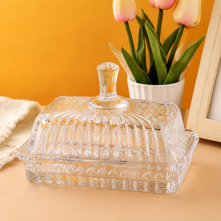 Front view of ribbed glass butter dish with fluted lid knob