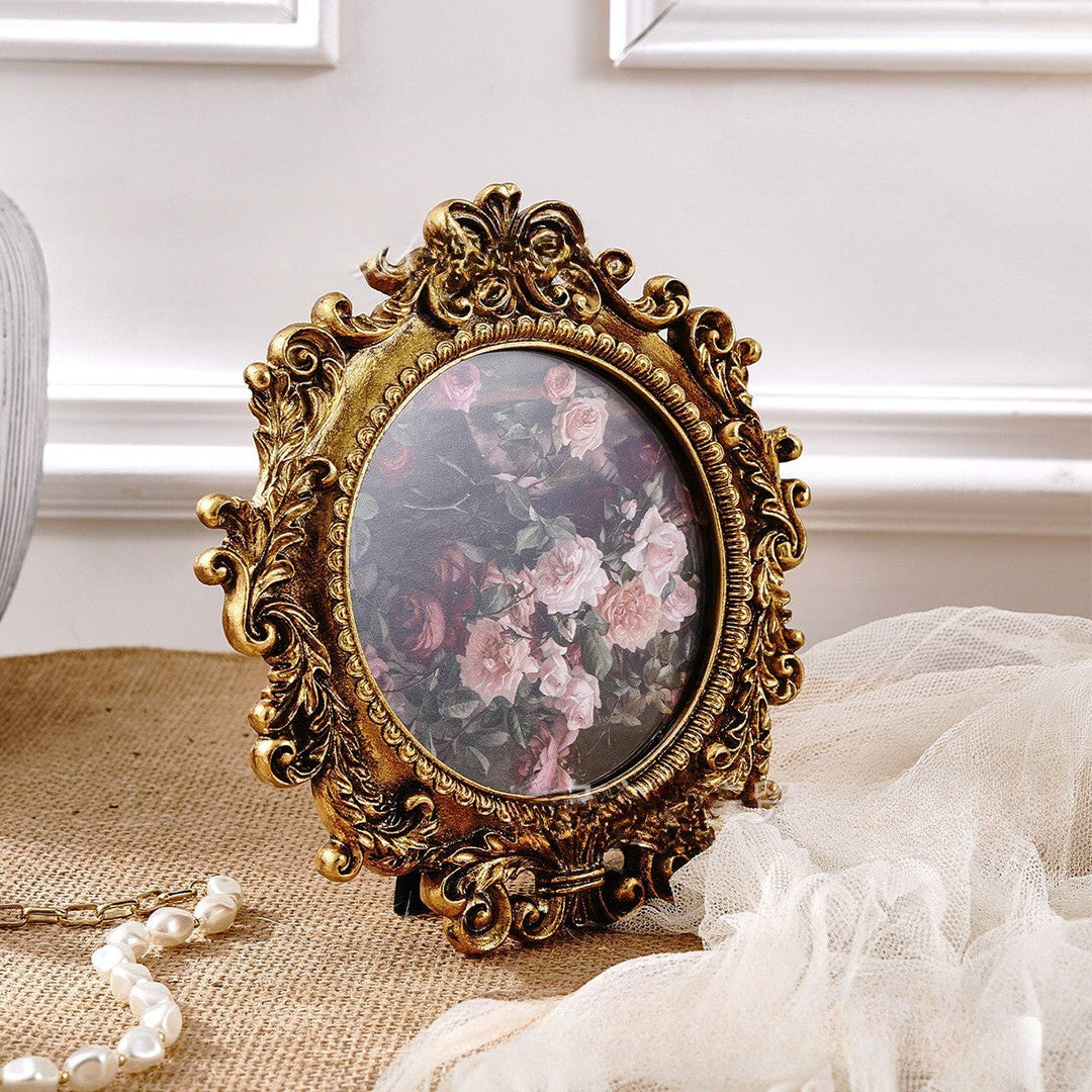 Rococo Round Gold Photo Frame resting on its tabletop easel