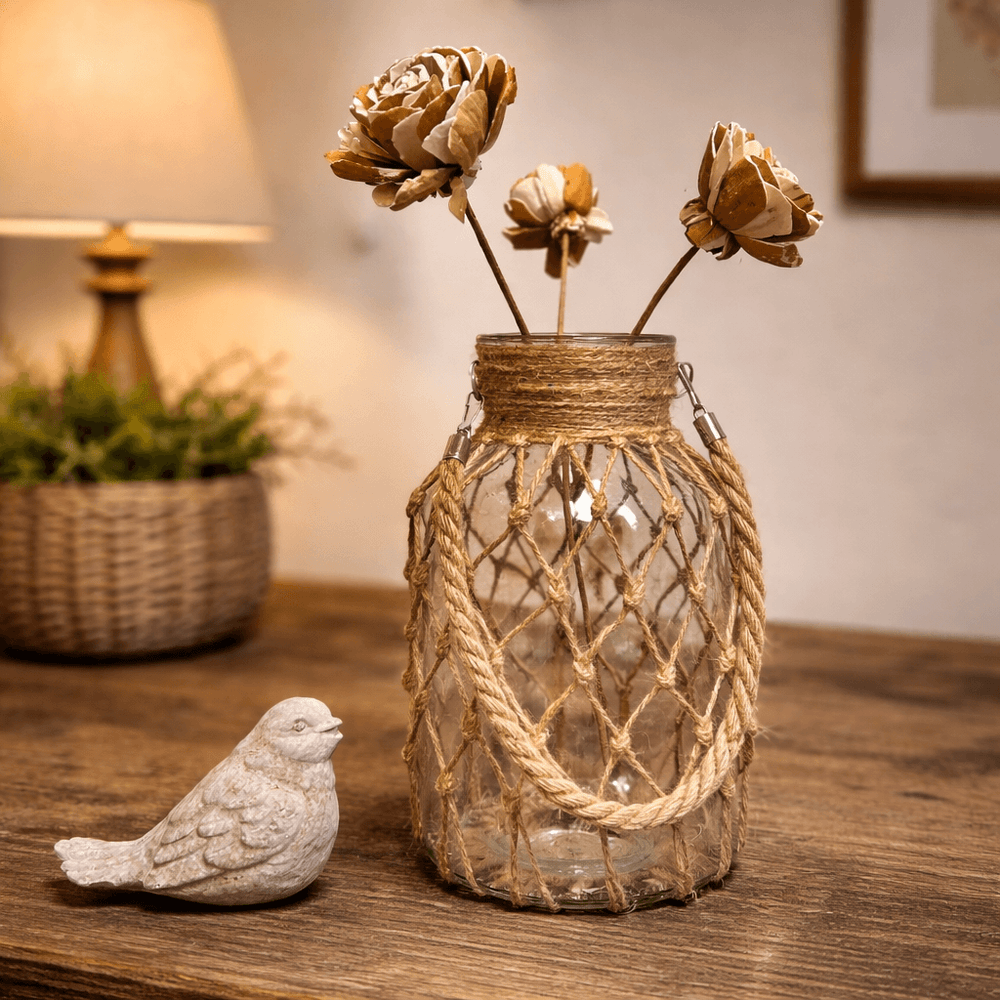 Large rope-wrapped bottle vase styled with sculptural stems