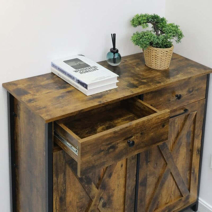 Rustic Farmhouse Tilt Out Trash Cabinet with warm wood finish, open drawer, black metal hardware, and decor items on top.